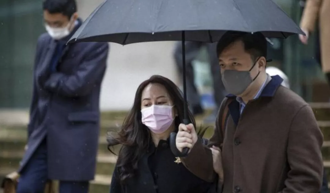 孟晚舟回国24小时后，她背后的男人火了